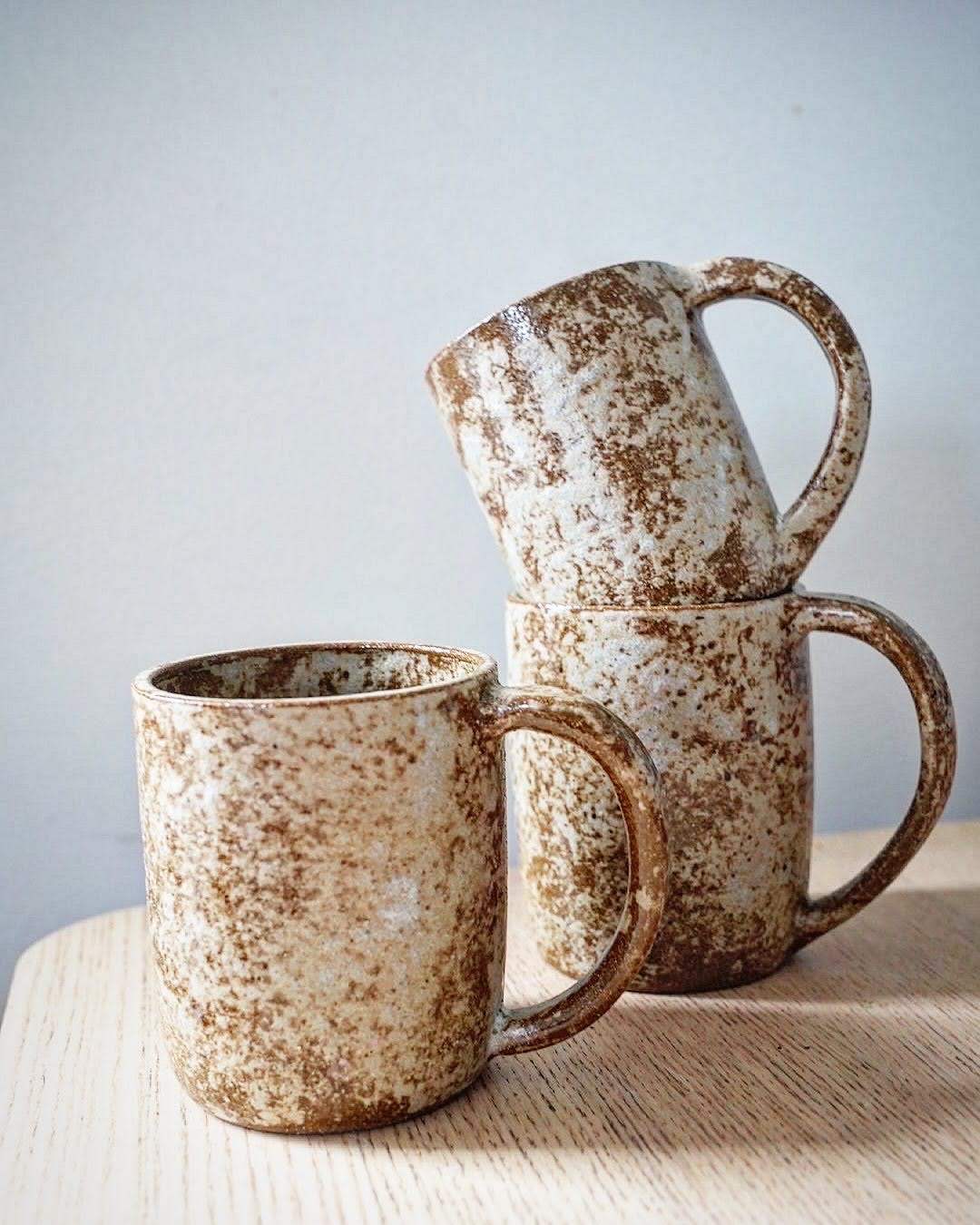 Several brown mugs